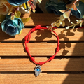 Pulsera roja 7 nudos con mano de Fátima y ojo turco